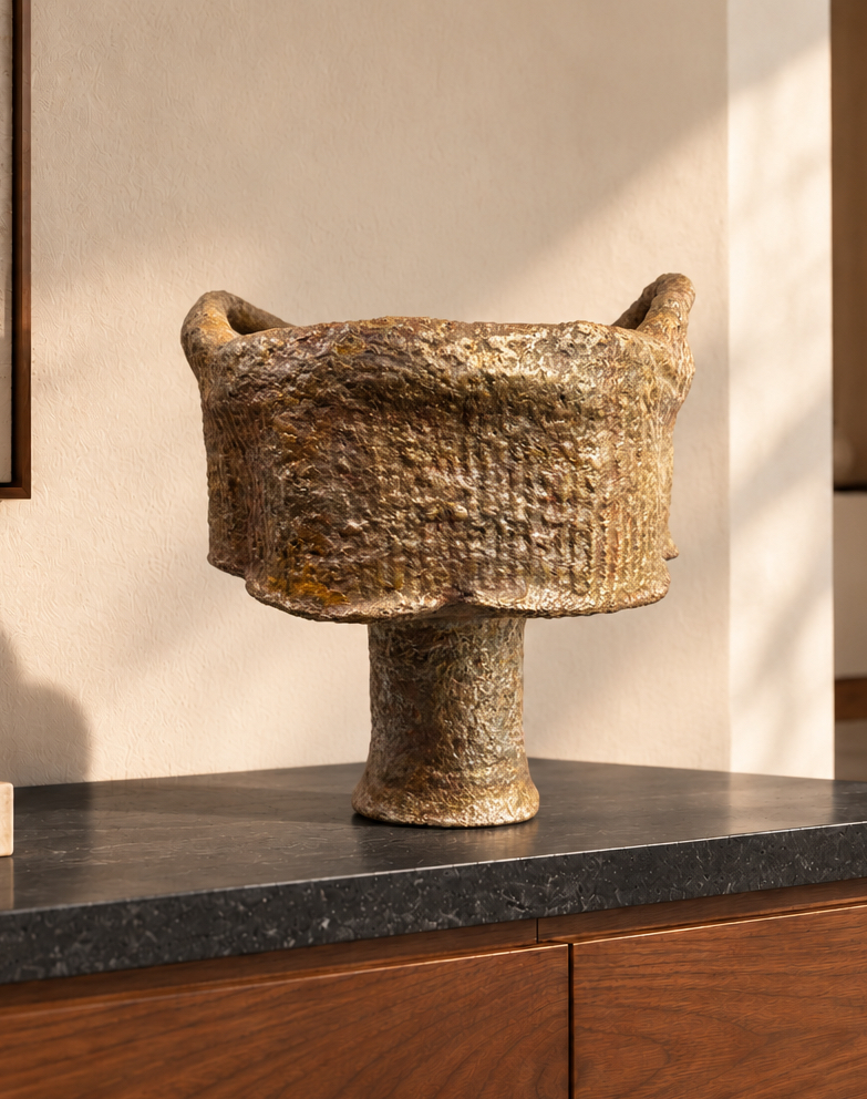 The Illusion of Metal — a papier-mâché sculpture with a metallic finish.